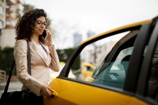 Businesswoman taking a taxi ride